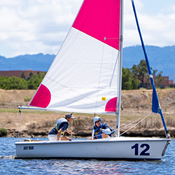 An instructor teaching sailing on the lake